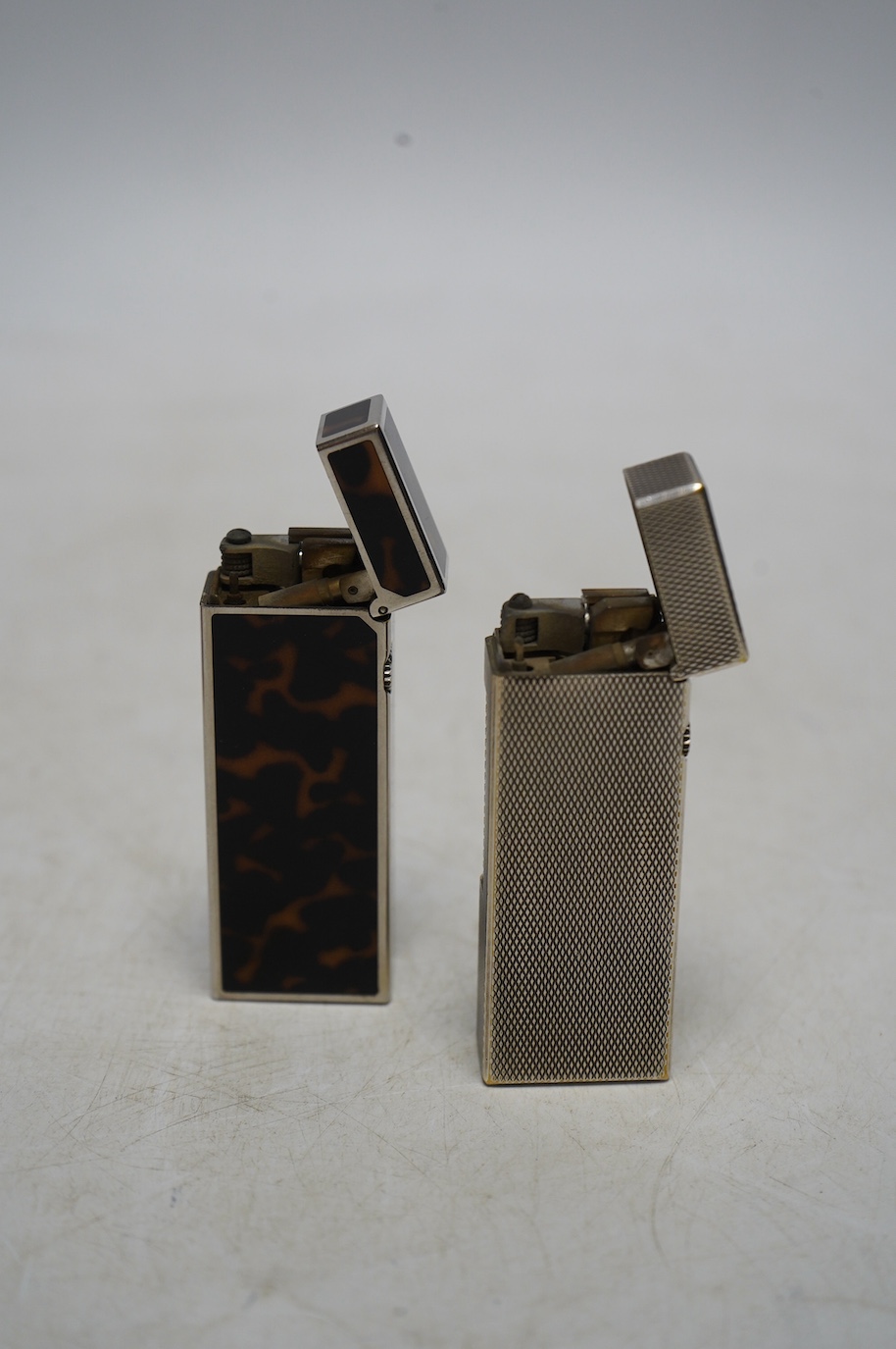 Two Dunhill lighters and a Coronation medal. Condition - some scratches